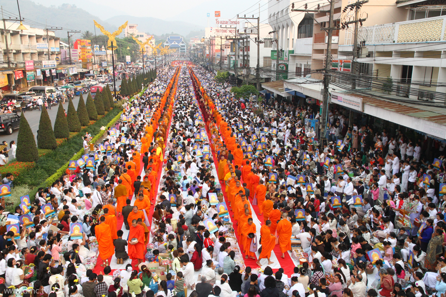 The Morning Alms Round to 10,000 Monks from Three Countries at the Northernmost of Thailand The Morning Alms Round to 10,000 Monks from Three Countries at the Northernmost of Thailand